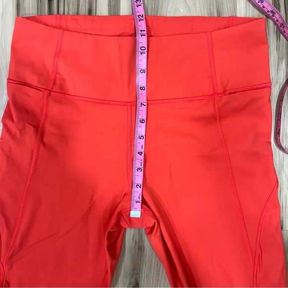 Athleta x Peloton Velocity 7/8 Orange Leggings with Zipper Pouch - Picture 10 of 11